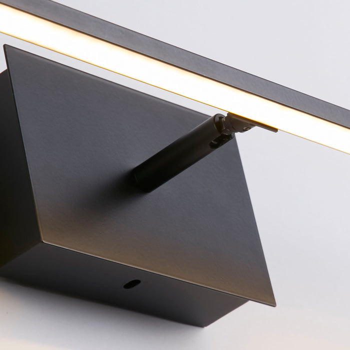 Close-up of Amalfi bathroom light's black backplate, pivot and warm glowing LED strip