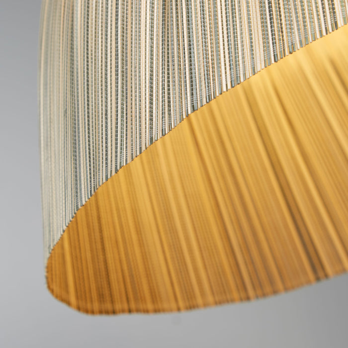 Close-up of the bamboo dome shade's striped weave and warm golden inner surface