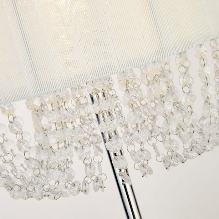 Close-up of the Bellano lamp's clear acrylic bead strands hanging beneath the white shade