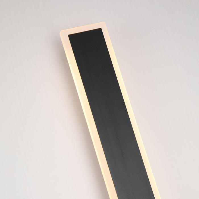 Close-up of the tall Bordo bar's black textured panel and bright warm LED border