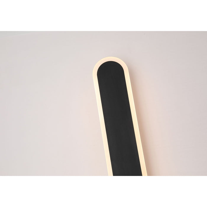 Detail of the Bordo bar's rounded end with its illuminated warm white edge against the wall