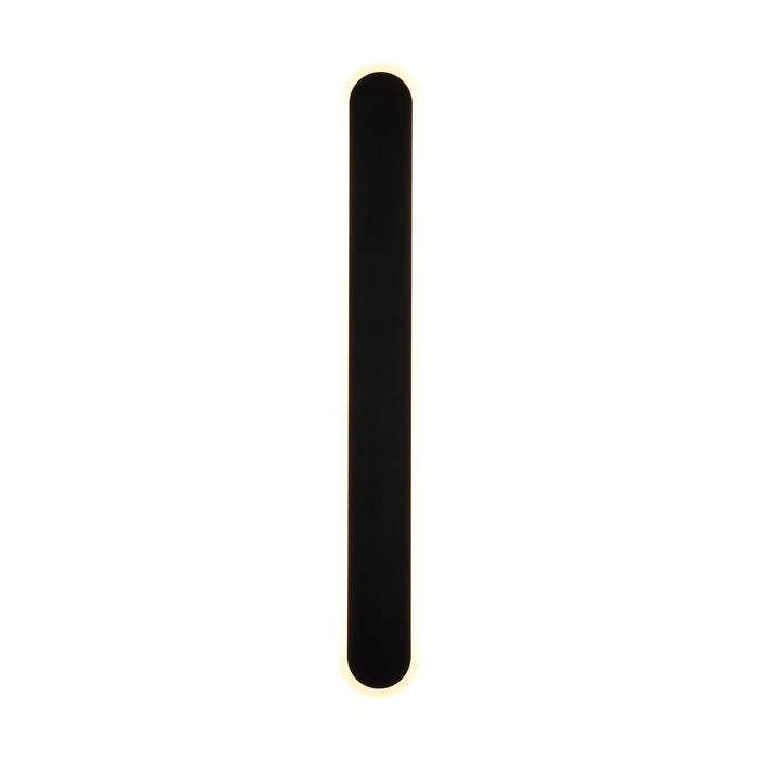 Bordo sand black LED wall light lit, compact rounded bar with a glowing warm white outline