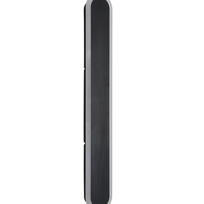 Bordo sand black LED wall bar seen edge-on, showing its slim rounded profile against a pale wall