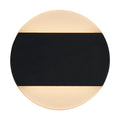 Cavern black LED wall light lit as a round disc with glowing top and bottom halves