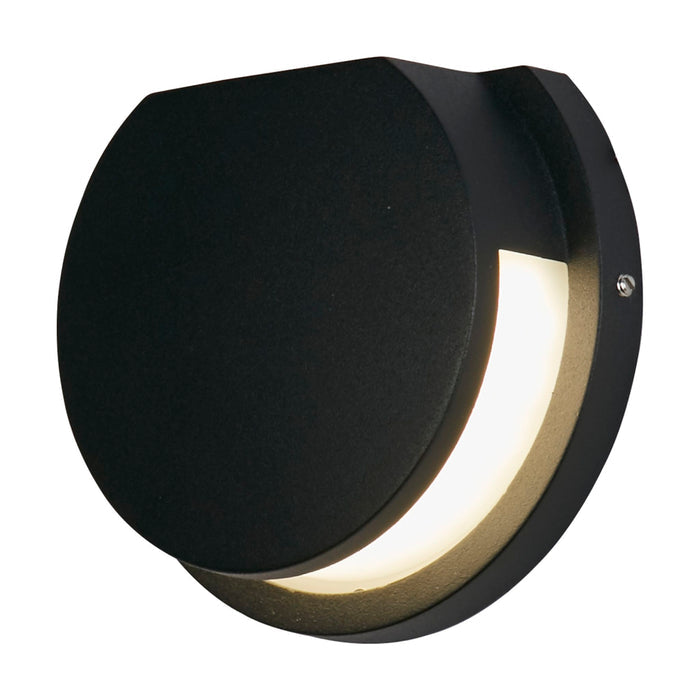 Chiswick black LED wall light lit as a round disc with a crescent glowing diffuser