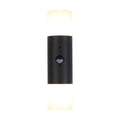 Colorado black up and down wall light lit with opal diffusers and a central PIR sensor