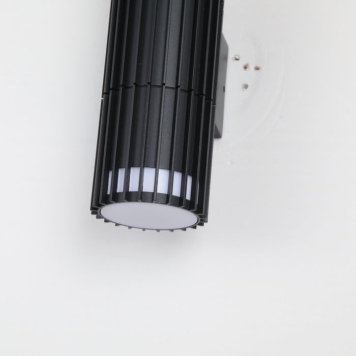 Close-up of the Detroit cylinder's black slats and bright circular lower diffuser