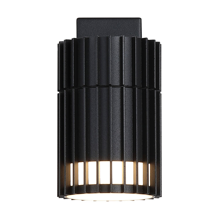 Detroit matt black outdoor wall light lit, slatted cylinder shade with warm light through the fins