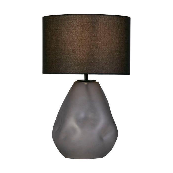 Devon table lamp with dimpled frosted grey glass base lit under a black linen shade