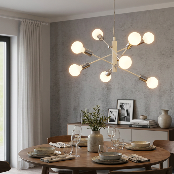 A white and chrome 8-light Sputnik pendant illuminates a modern dining room with a wooden table and textured grey wall.