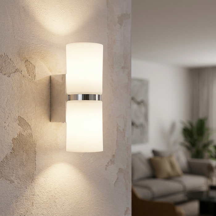 Eglo Passa chrome and white up and down wall light mounted on a textured wall in a living room.