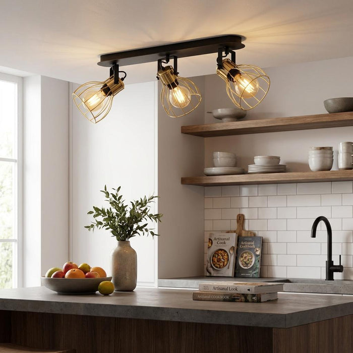 Industrial 3-light ceiling spotlight with brass wire shades and Edison bulbs in a modern kitchen setting.