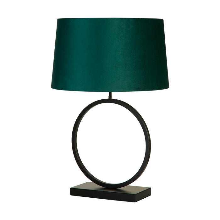 Elegant matt black table lamp unlit with emerald velvet shade on a white studio background