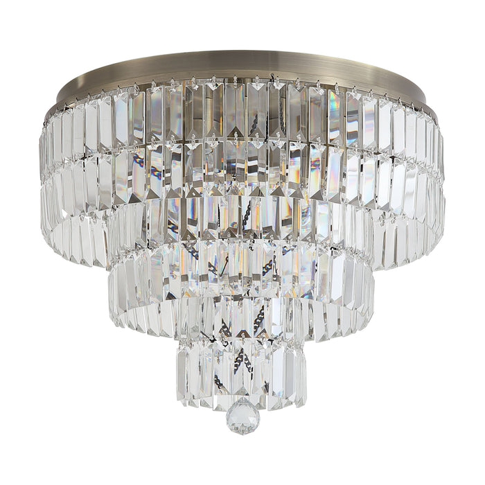 Empire antique brass bathroom ceiling light unlit on white, tiered clear crystal prisms and finial
