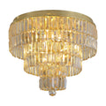 Empire satin brass flush ceiling light with six tiers of clear crystal prisms lit warmly