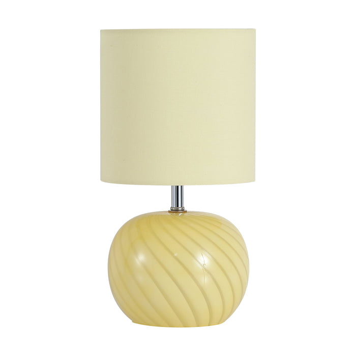 Fete table lamp unlit on white showing swirling yellow glass globe base and cream shade