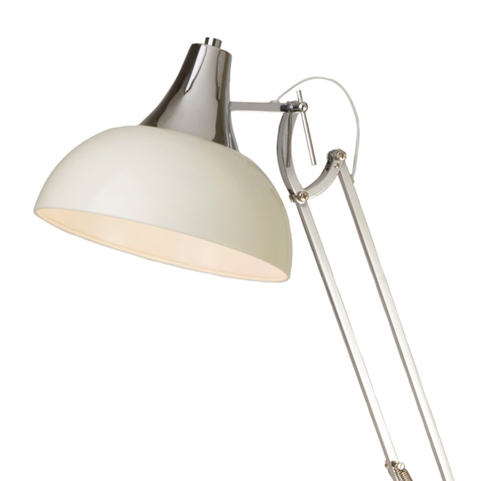 Close-up of the Goliath cream dome shade with chrome yoke and polished adjustable arm joints