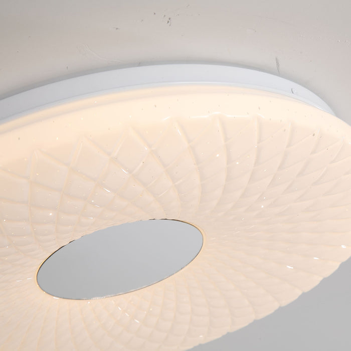 Detail of the Haolux diffuser's radiating ribbed texture and central chrome disc