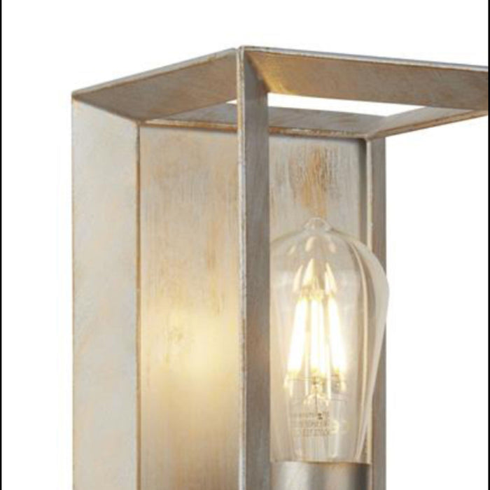 Close-up of the Heaton lantern's metal frame corners and glowing filament bulb