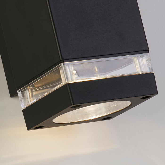 Detail of the Houston black square body, clear glass band and recessed downlight lens