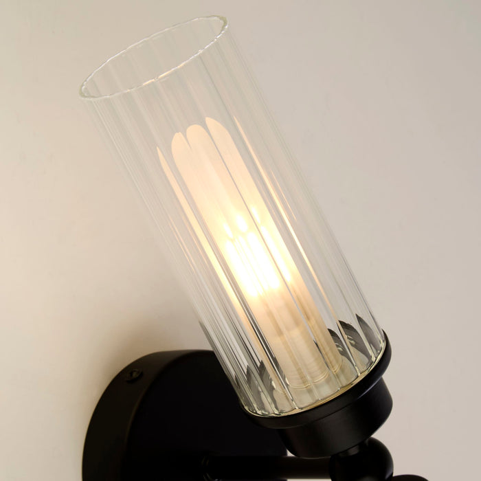 Detail of an Imperial fluted glass cylinder with inner opal sleeve on its matt black gallery