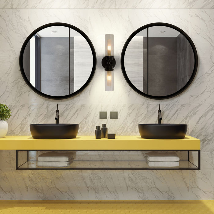 Imperial twin black wall light between round mirrors above black basins on a yellow bathroom vanity