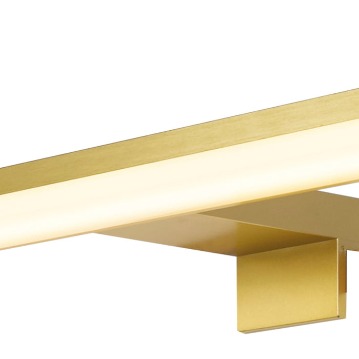 Detail of the Kos gold bracket and the warm glow along its LED diffuser