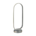 Liner chrome table lamp with glowing integrated LED oval loop on a round polished base