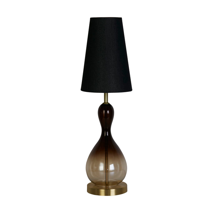 Marakesh ombre and gold glass table lamp unlit with black linen shade on a white studio background