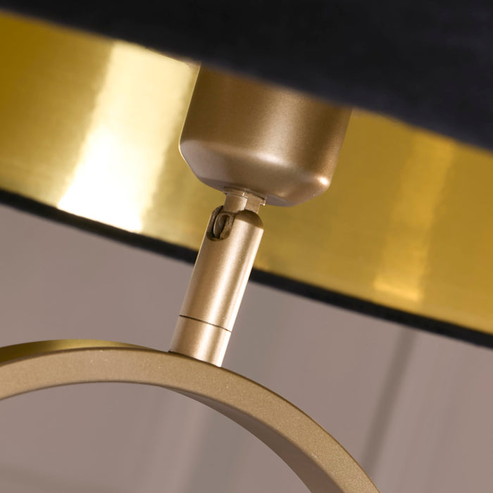 Detail of the brushed bronze holder and gold trim under the Modish black velvet shade