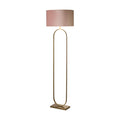 Modish bronze floor lamp lit with a pink velvet drum shade on a slim oval hoop frame