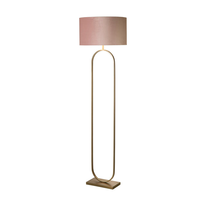 Modish bronze floor lamp lit with a pink velvet drum shade on a slim oval hoop frame