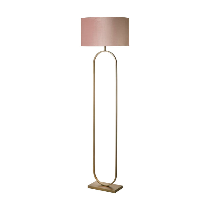 Modish bronze oval floor lamp unlit on white with a pink velvet drum shade and rectangular base