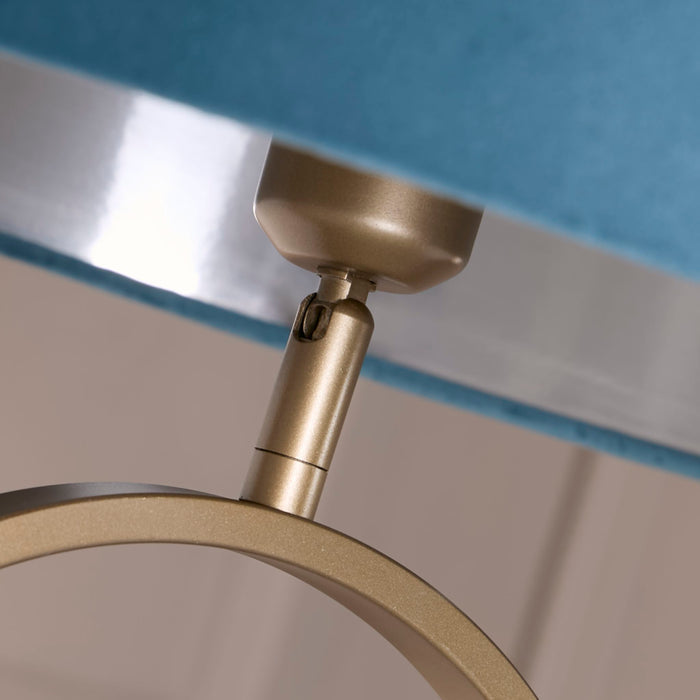 Detail of the Modish bronze fitting and polished silver trim against the teal velvet shade