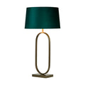 Modish bronze table lamp lit with an emerald velvet shade above a slim oval hoop base