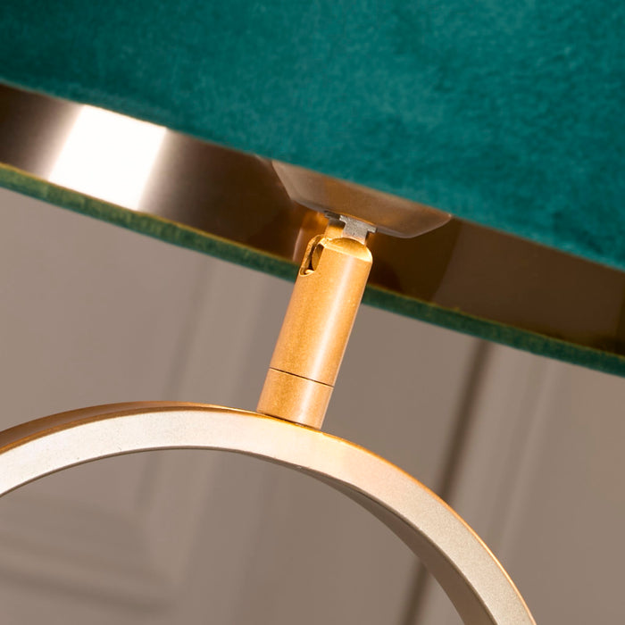 Close-up of the Modish lamp emerald velvet shade rim and bronze fitting above the hoop