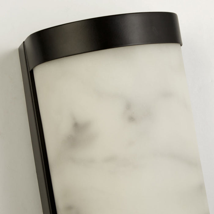 Detail of the Nile light's black trim meeting its veined marble-effect shade