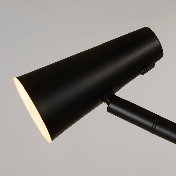 Close-up of the matt black cone head and touch dimmer switch on the rechargeable floor lamp