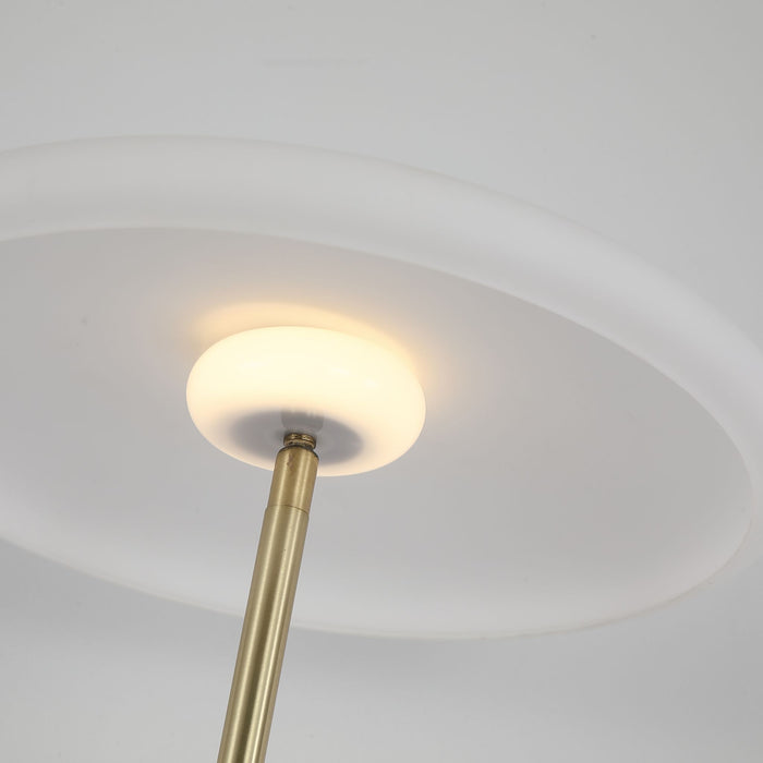 Close-up of the Record lamp's opal disc diffuser and satin brass stem from below
