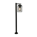 Reed black outdoor post light lit with a caged clear glass lantern on a tall slim post