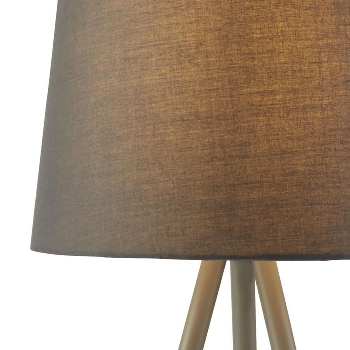 Close-up of the Rio lamp's grey textured fabric shade above satin silver tripod legs