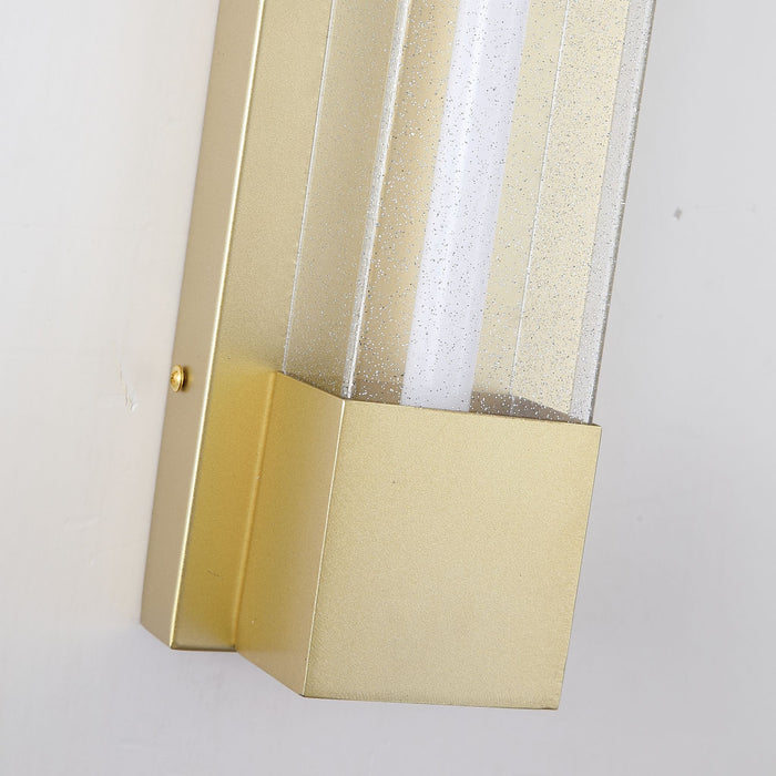 Close-up of the Sacramento light's brushed gold bracket and bubbled seeded glass