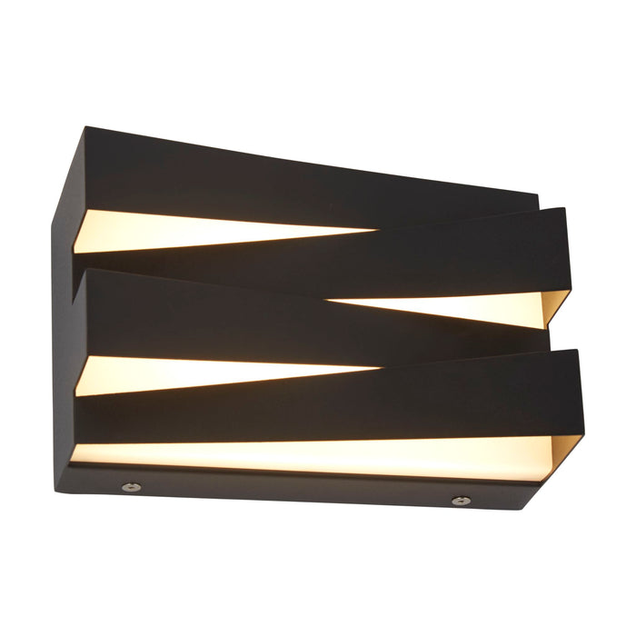 Section sand black LED wall light lit, angled stepped fins with warm light escaping
