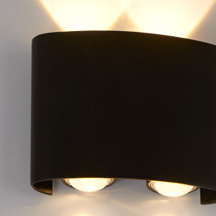 Close-up of the Shadows light's textured black curve and four glowing LED lenses