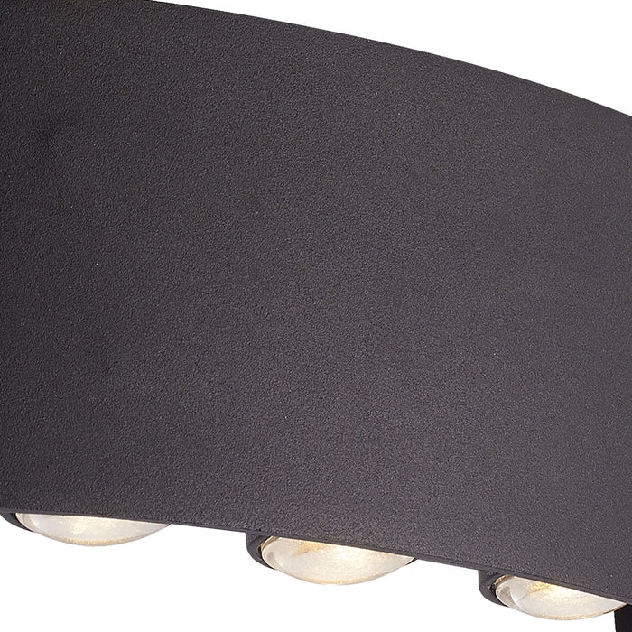 Close-up of the Shadows housing's textured black curve and row of recessed LED lenses