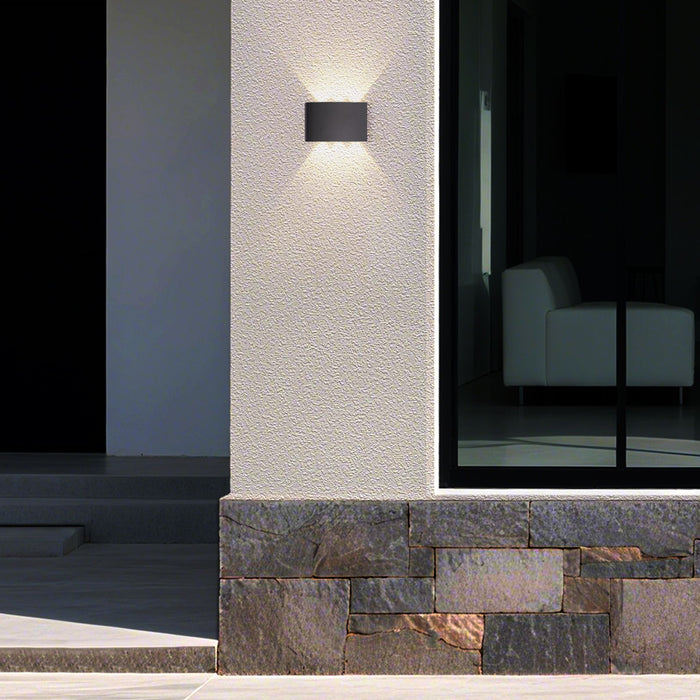 Shadows black wall light up and down lighting a rendered pillar above a stone clad wall