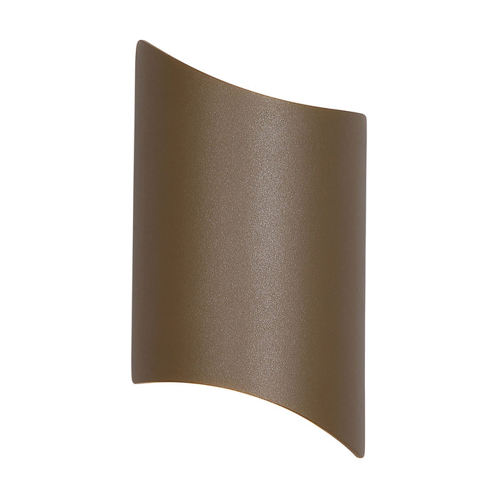 Shard gold outdoor wall light lit, curved textured plate washing light up and down the wall