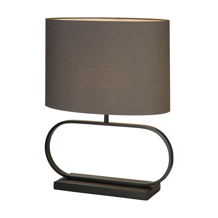 Sleek matt black table lamp with oval hoop base and lit grey oval fabric shade