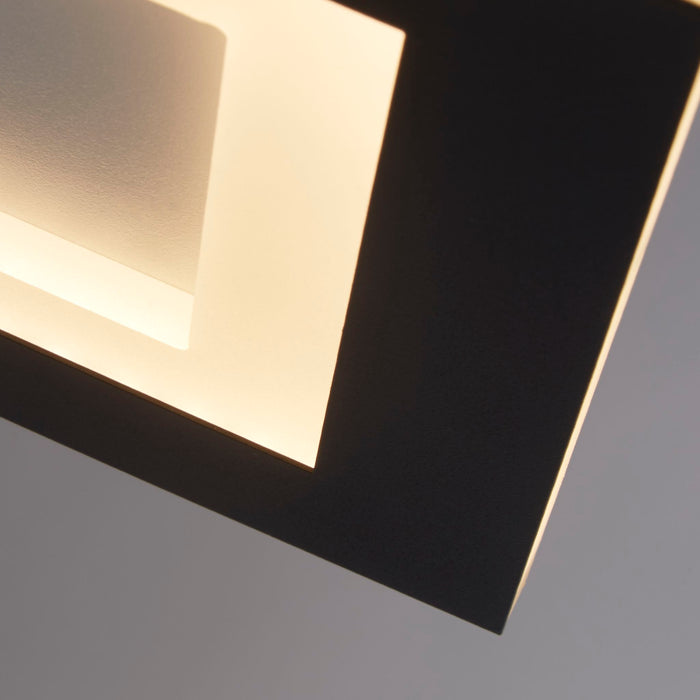 Close-up of Squary's matt black square edge and warm glowing recessed LED diffuser
