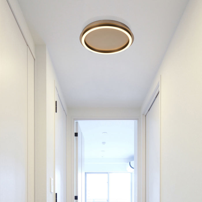 White hallway ceiling fitted with the Stellaris latte LED flush light near open doors